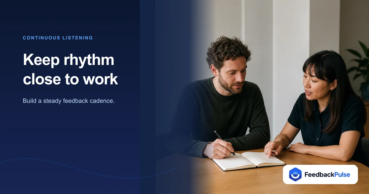 Two colleagues discuss continuous listening over an open notebook.